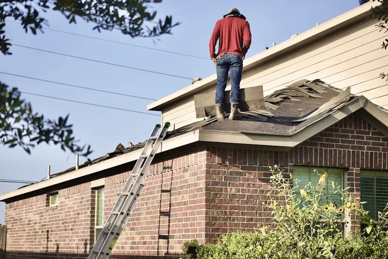 Professional roofer working on a residential roof in Largo
